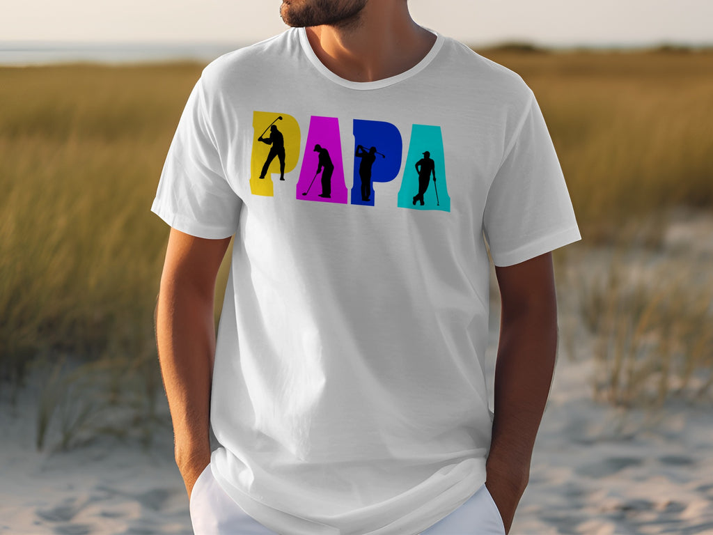White t-shirt with colorful "PAPA" text featuring golfer silhouettes.