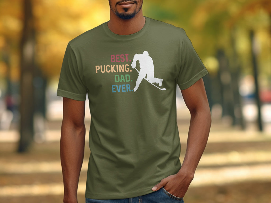 Green t-shirt with white hockey player and "Best. Pucking. Dad. Ever." text.