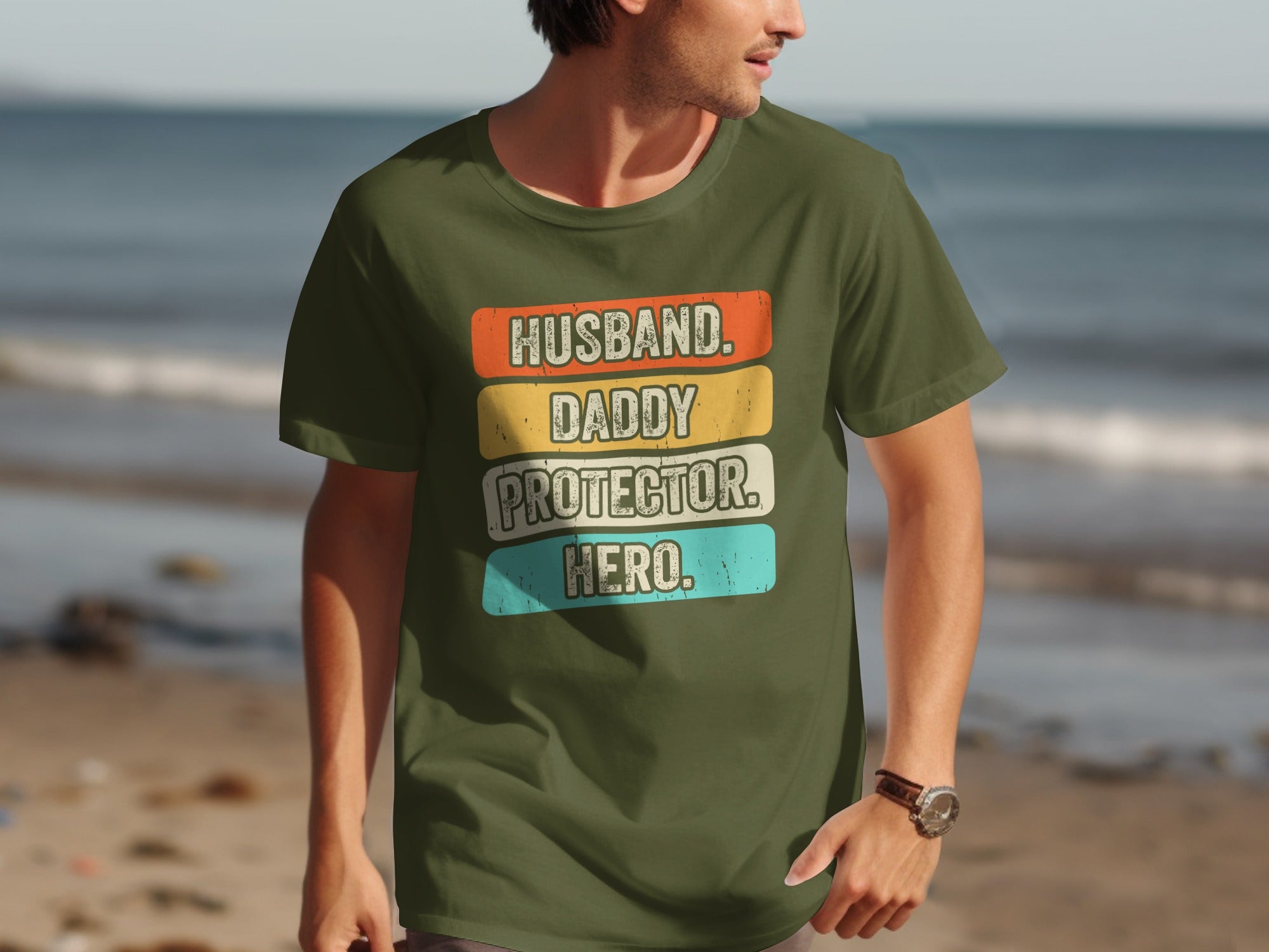 Olive green t-shirt with text "Husband. Daddy. Protector. Hero."