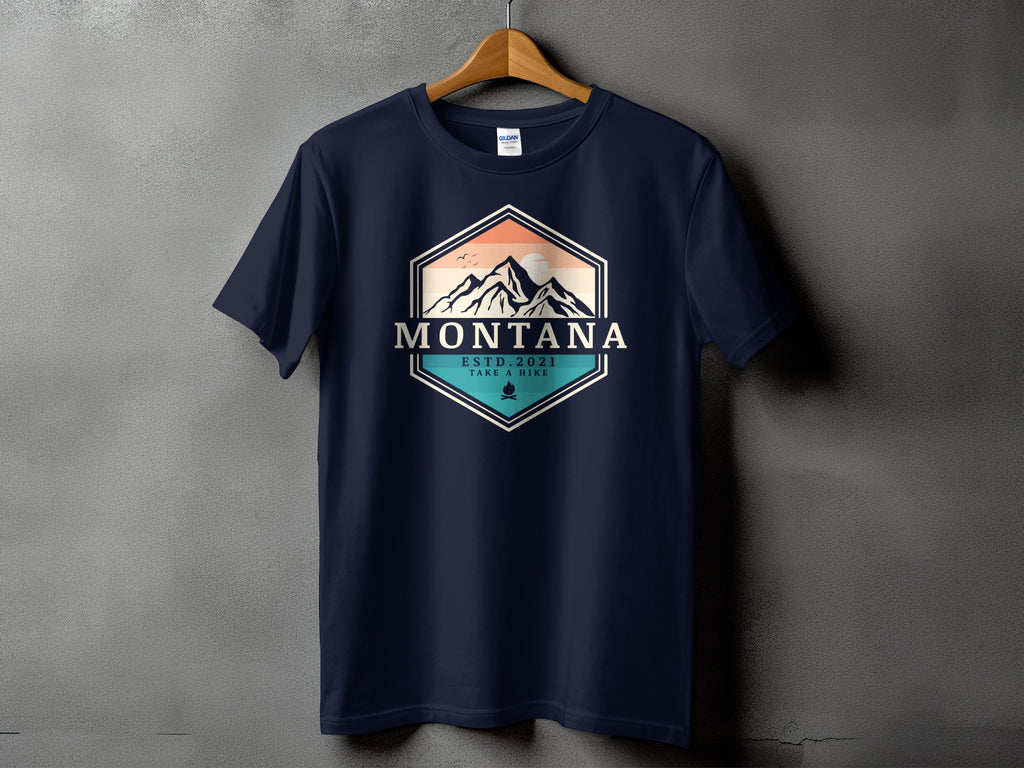 Navy t-shirt with hexagonal Montana mountain graphic, est. 2021, and take a hike text.