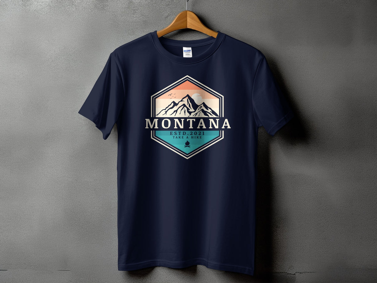 Navy t-shirt with hexagonal Montana mountain graphic, est. 2021, and take a hike text.
