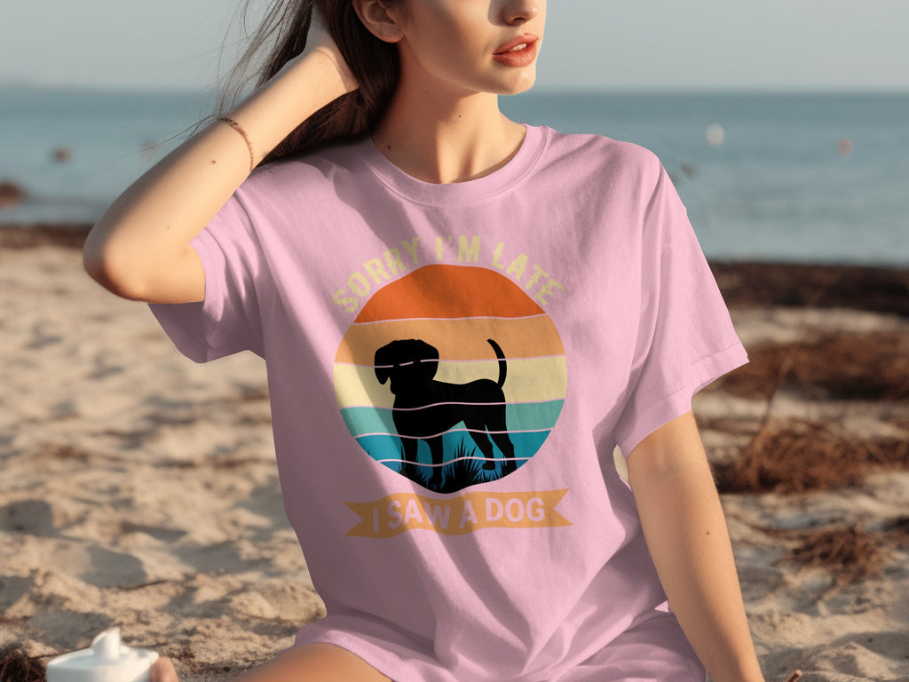 Pink t-shirt with "Sorry I'm Late I Saw A Dog" text and dog silhouette.