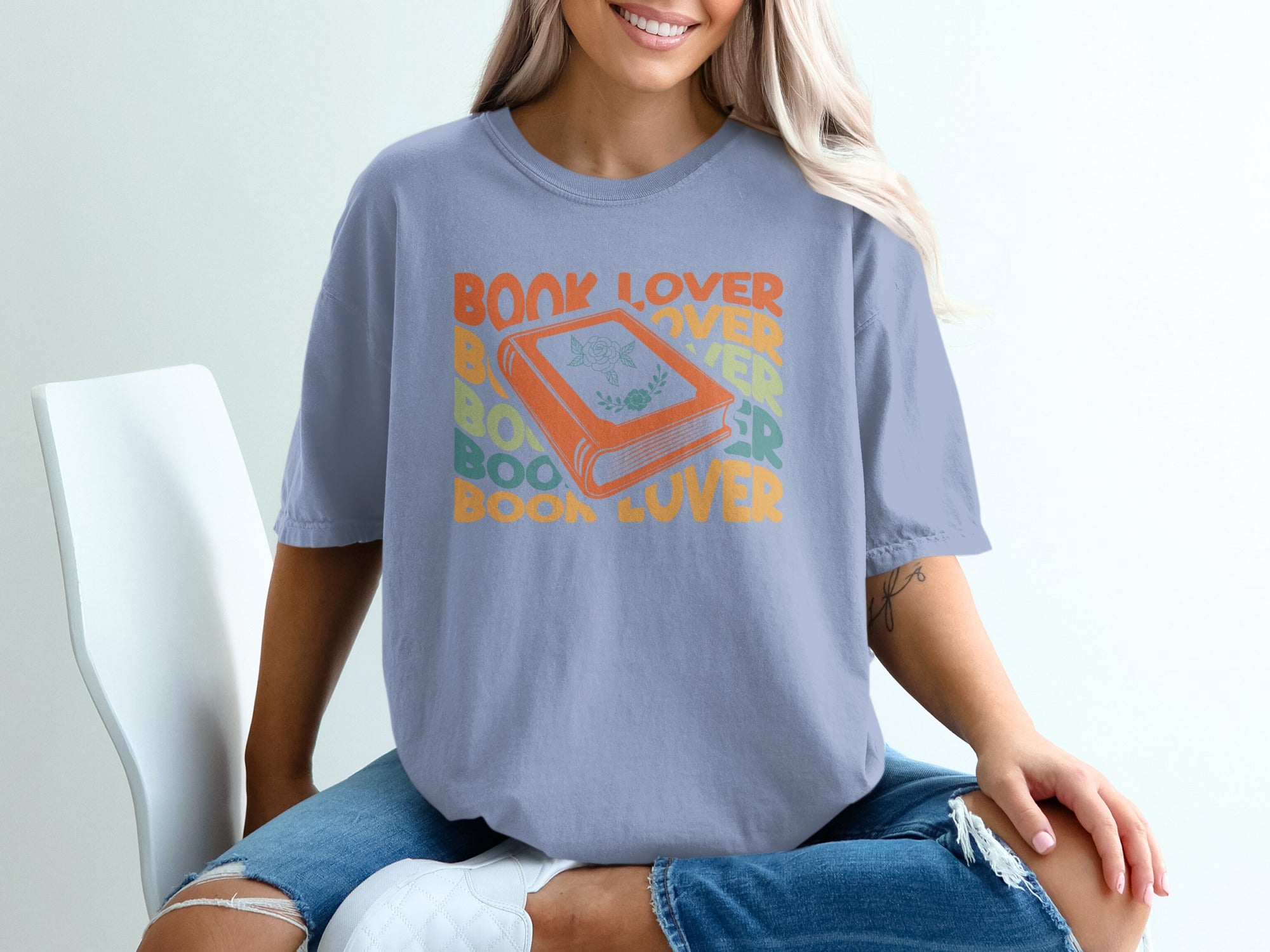 Shirt with orange book graphic and "BOOK LOVER" text.