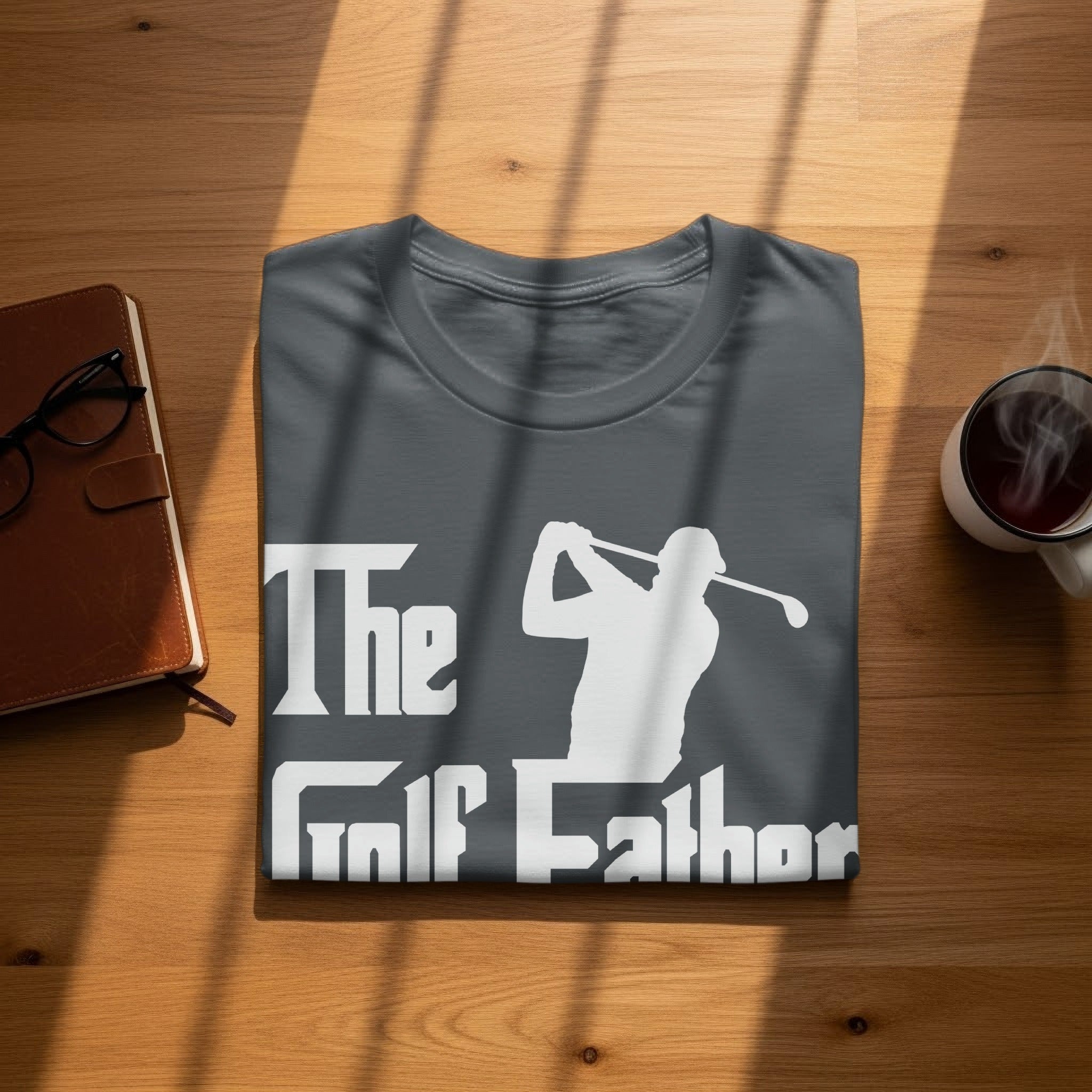 Charcoal t-shirt with white "The Golf Father" text and golfer silhouette.