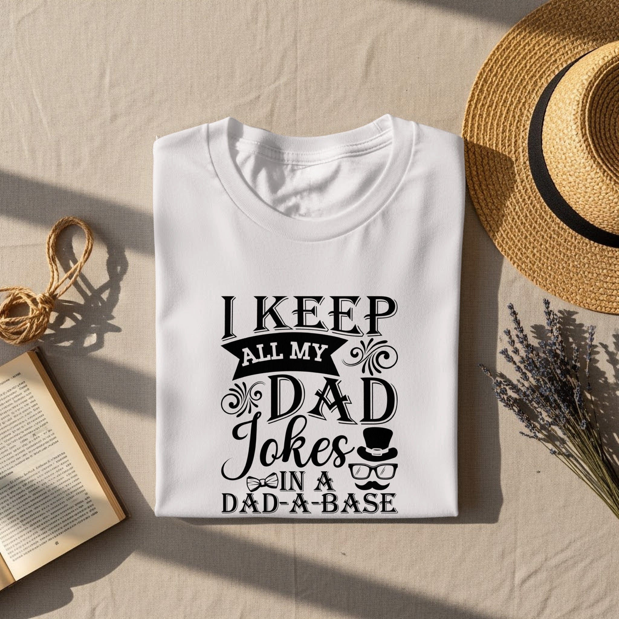 White t-shirt with "I KEEP ALL MY DAD Jokes IN A DAD-A-BASE" text.
