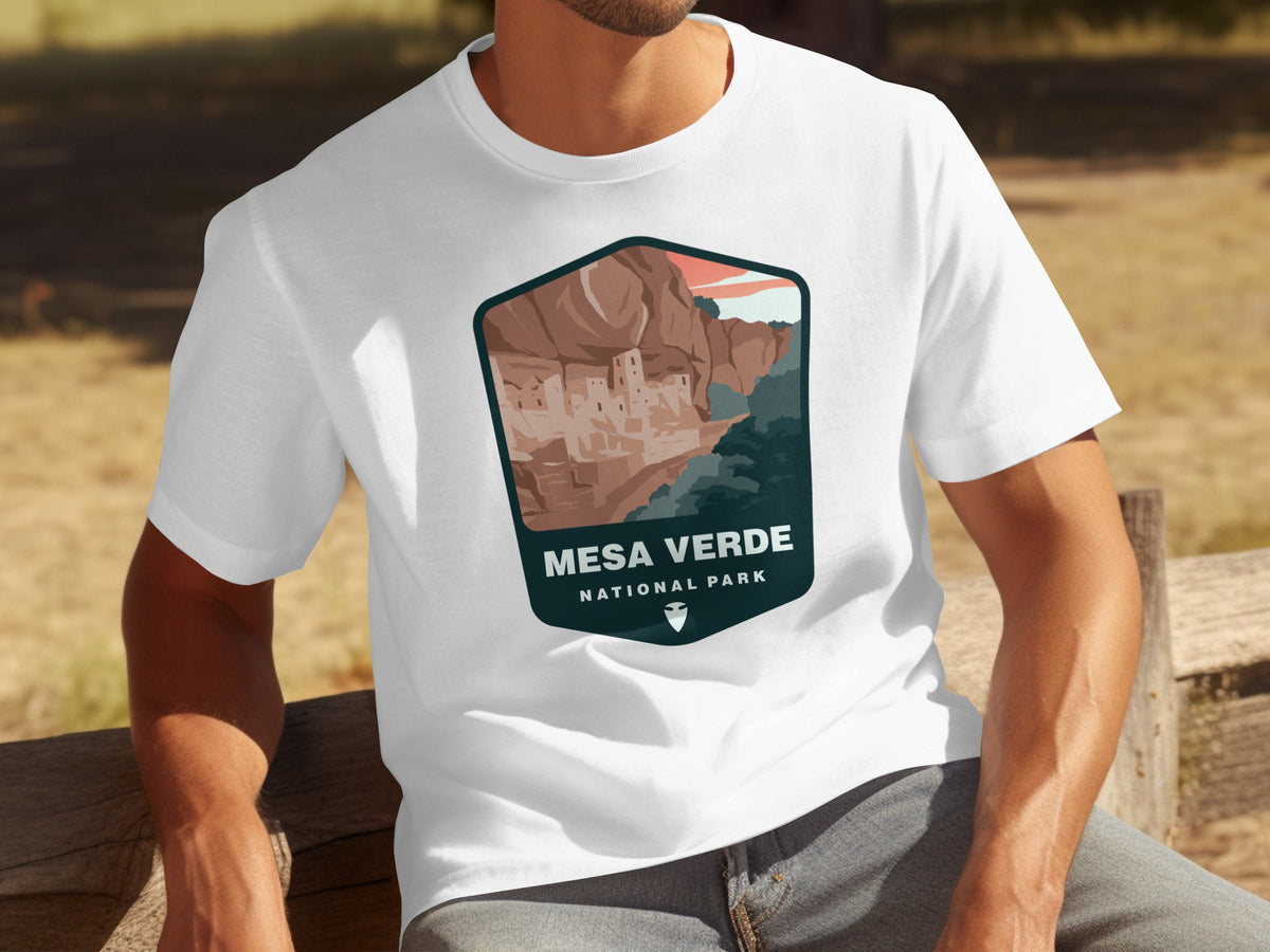 White t-shirt with Mesa Verde National Park cliff dwelling graphic.