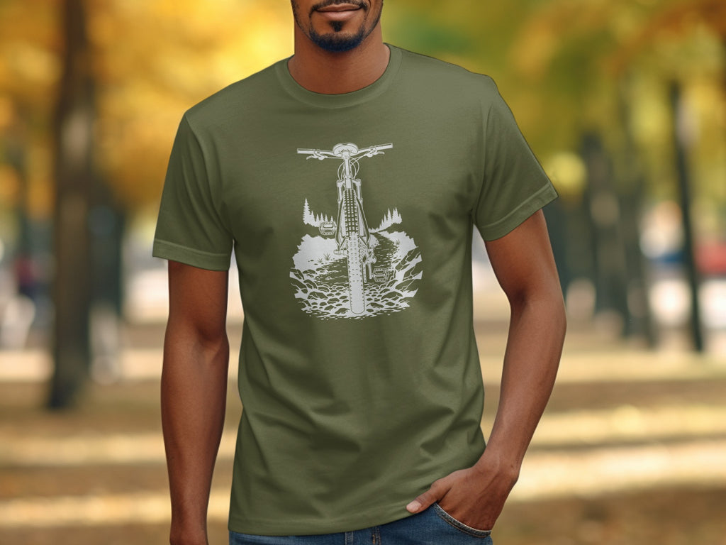 Olive t-shirt with a white graphic of a mountain bike on a rocky trail through trees.