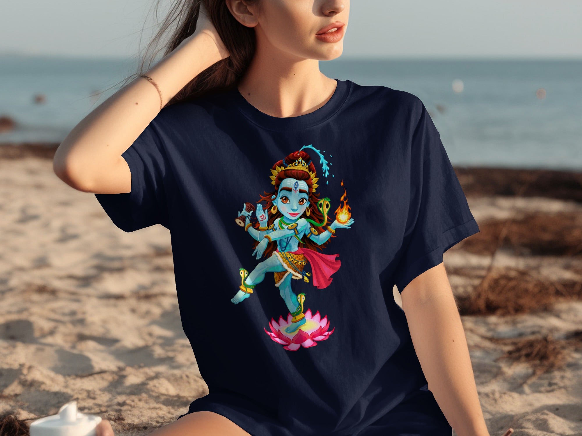 Navy t-shirt with a colorful cartoon illustration of Shiva on a lotus flower.