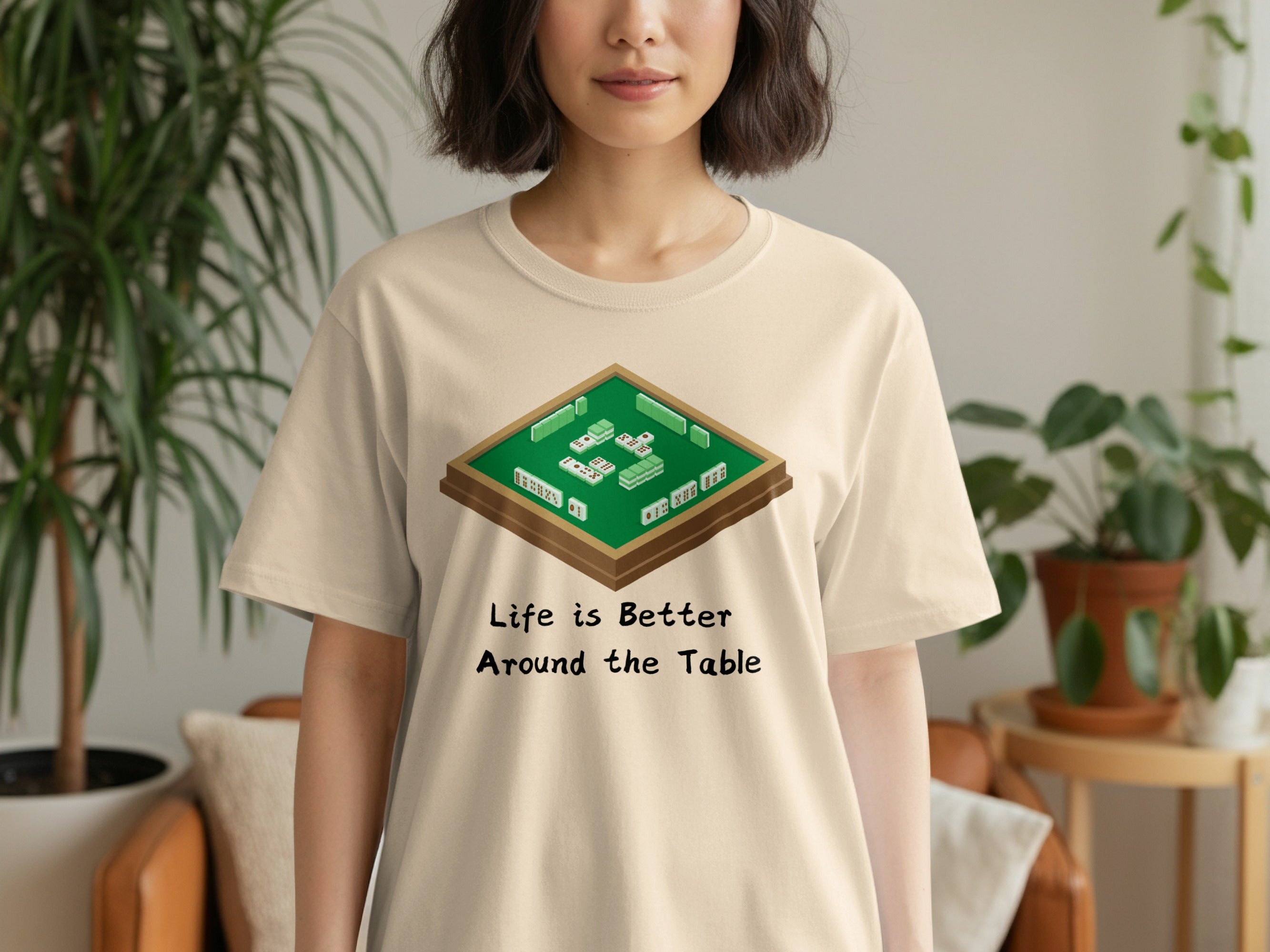Cream t-shirt with Mahjong tiles graphic and text: Life is Better Around the Table.