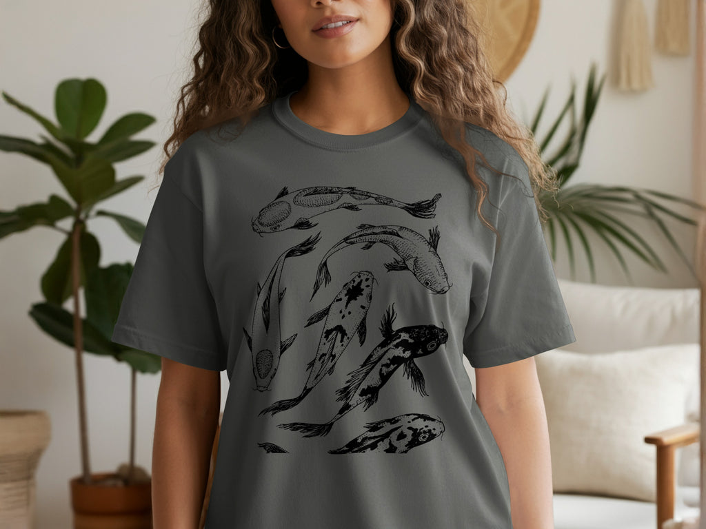 Dark grey t-shirt with a black line drawing of five koi fish in various sizes.