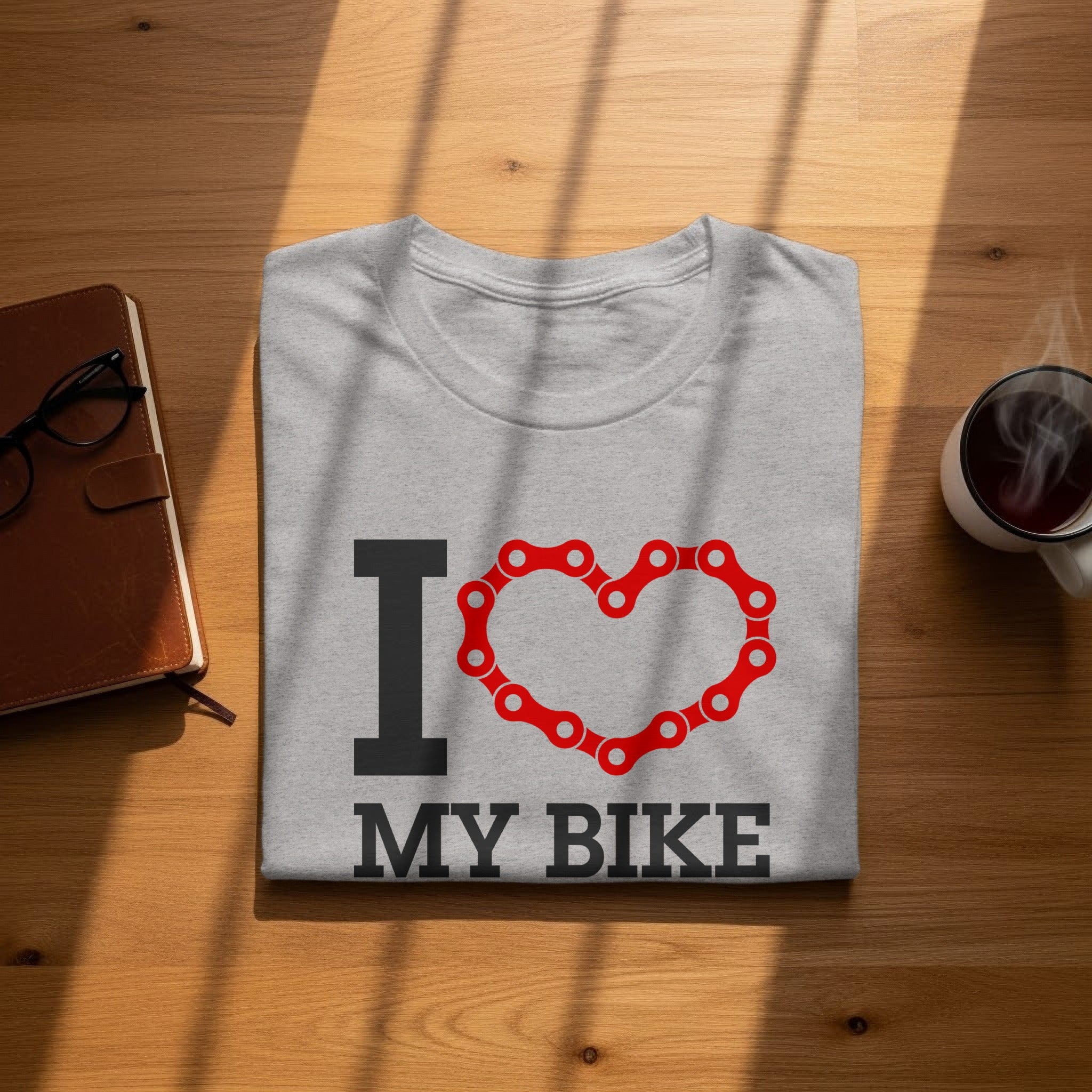 Grey t-shirt with "I ❤️ MY BIKE" text and bicycle chain heart graphic.