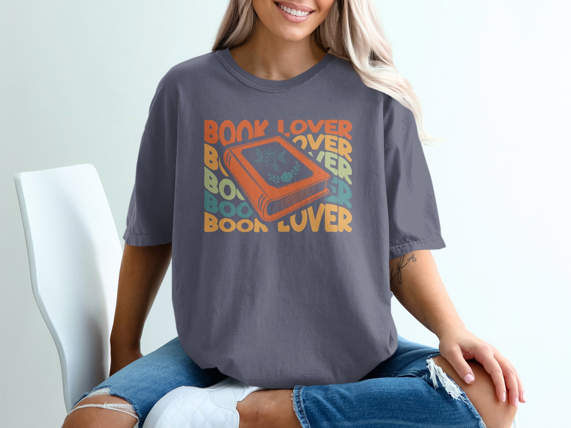 Grey t-shirt with orange book graphic and "Book Lover" text.