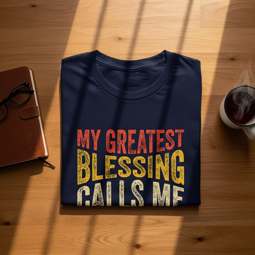 Navy t-shirt with text "MY GREATEST BLESSING CALLS ME"
