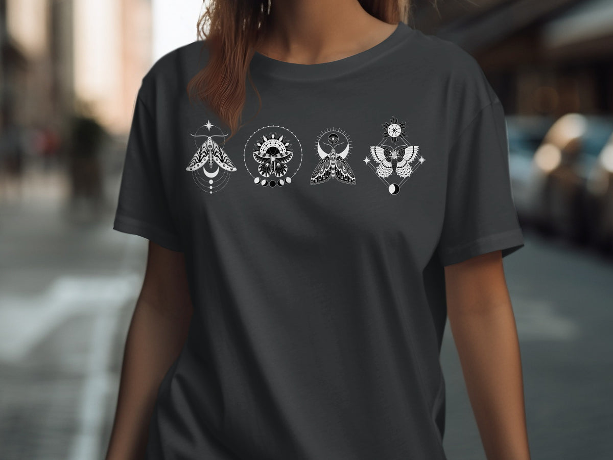 Dark t-shirt with four white celestial moth designs in a row.