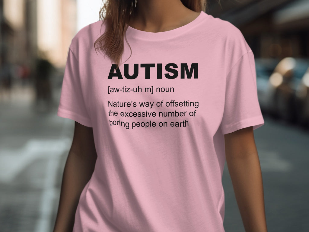 Pink t-shirt with black text defining "AUTISM" humorously.