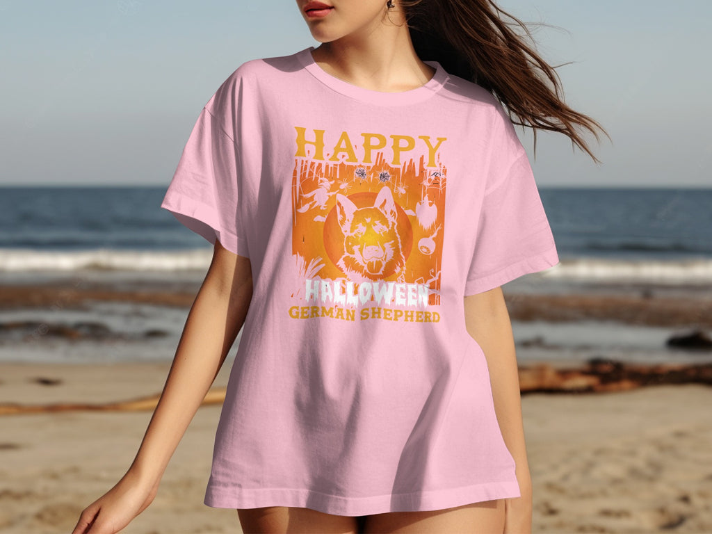 Pink t-shirt with a German Shepherd and Halloween graphic.