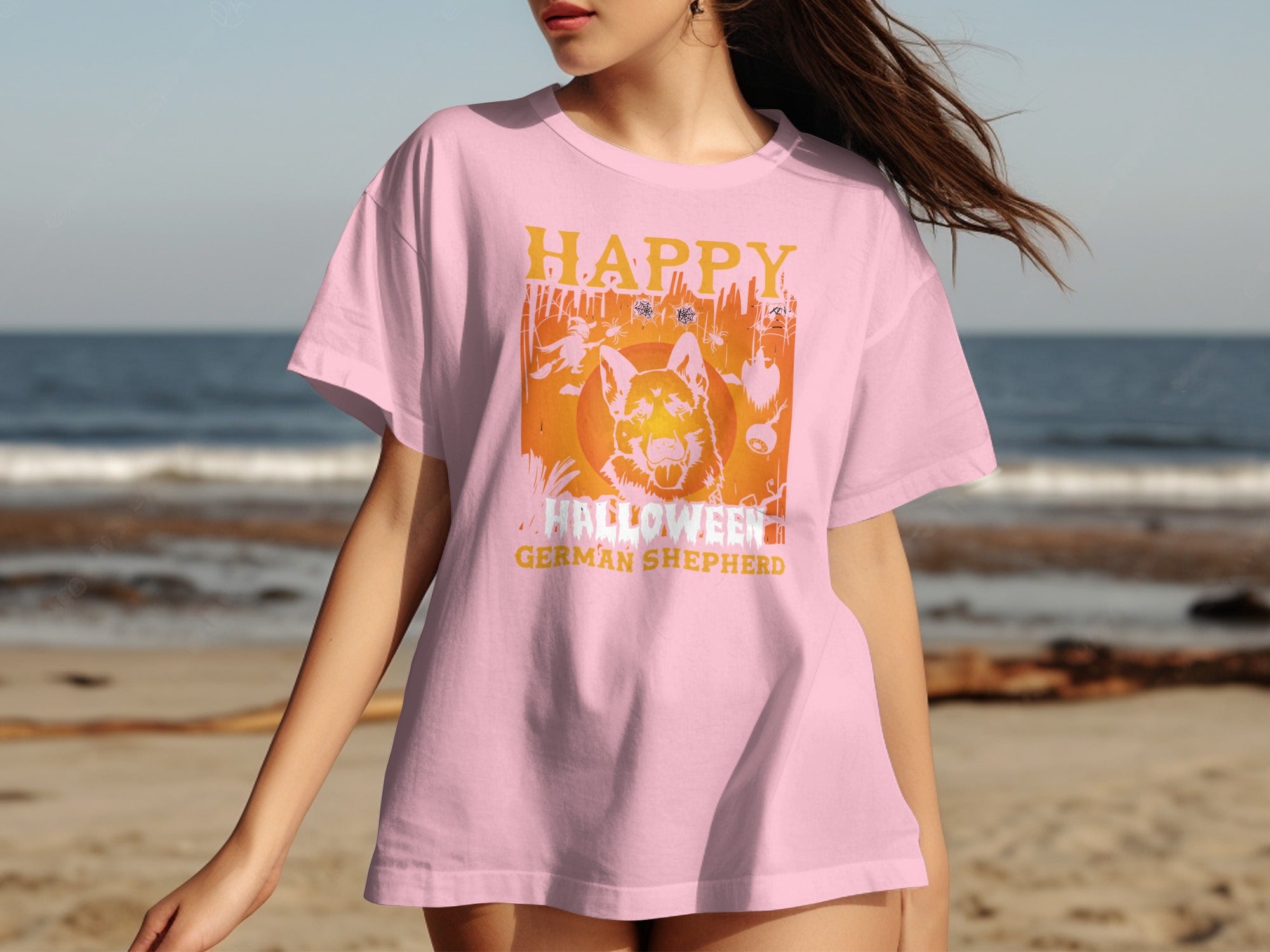 Pink t-shirt with a German Shepherd and Halloween graphic.