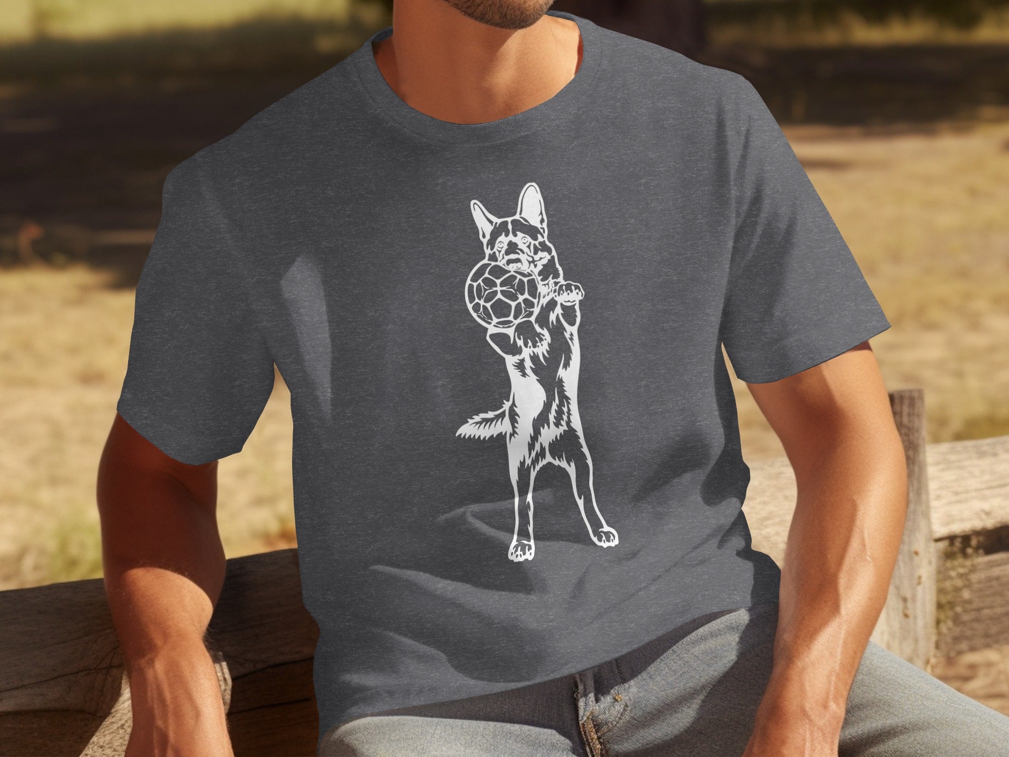 Dark grey t-shirt with white graphic of a dog holding a soccer ball.