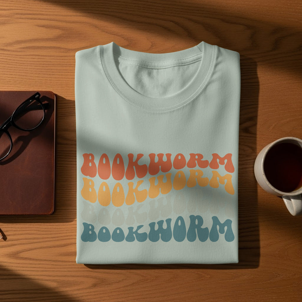 Light blue t-shirt with "BOOKWORM" text in ombre groovy font.