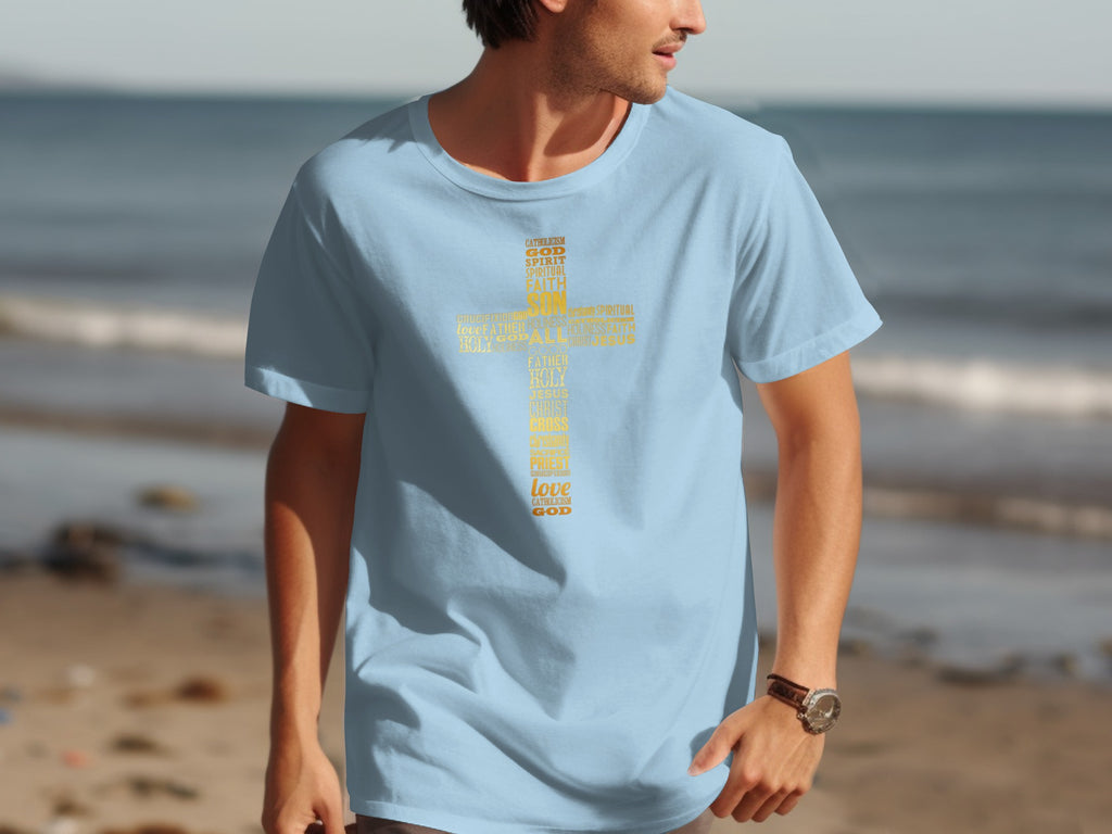 Light blue t-shirt with yellow text forming a cross: Catholicism, God, Spirit, Faith, Son, Jesus.