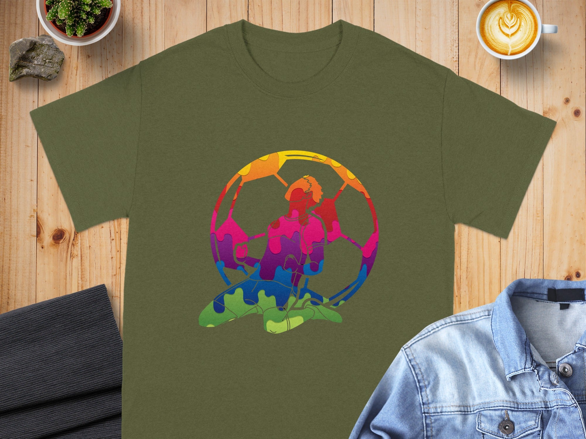 Olive green t-shirt with abstract colorful soccer player design.