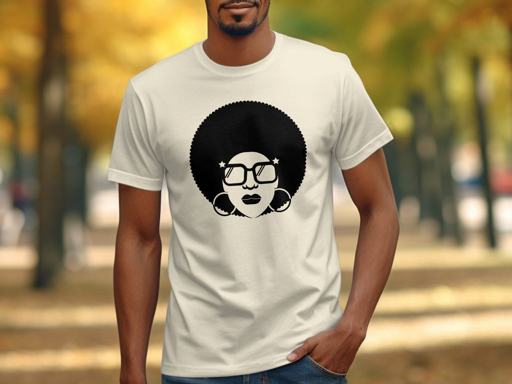 Cream t-shirt with black graphic of a woman's face with large afro and glasses.