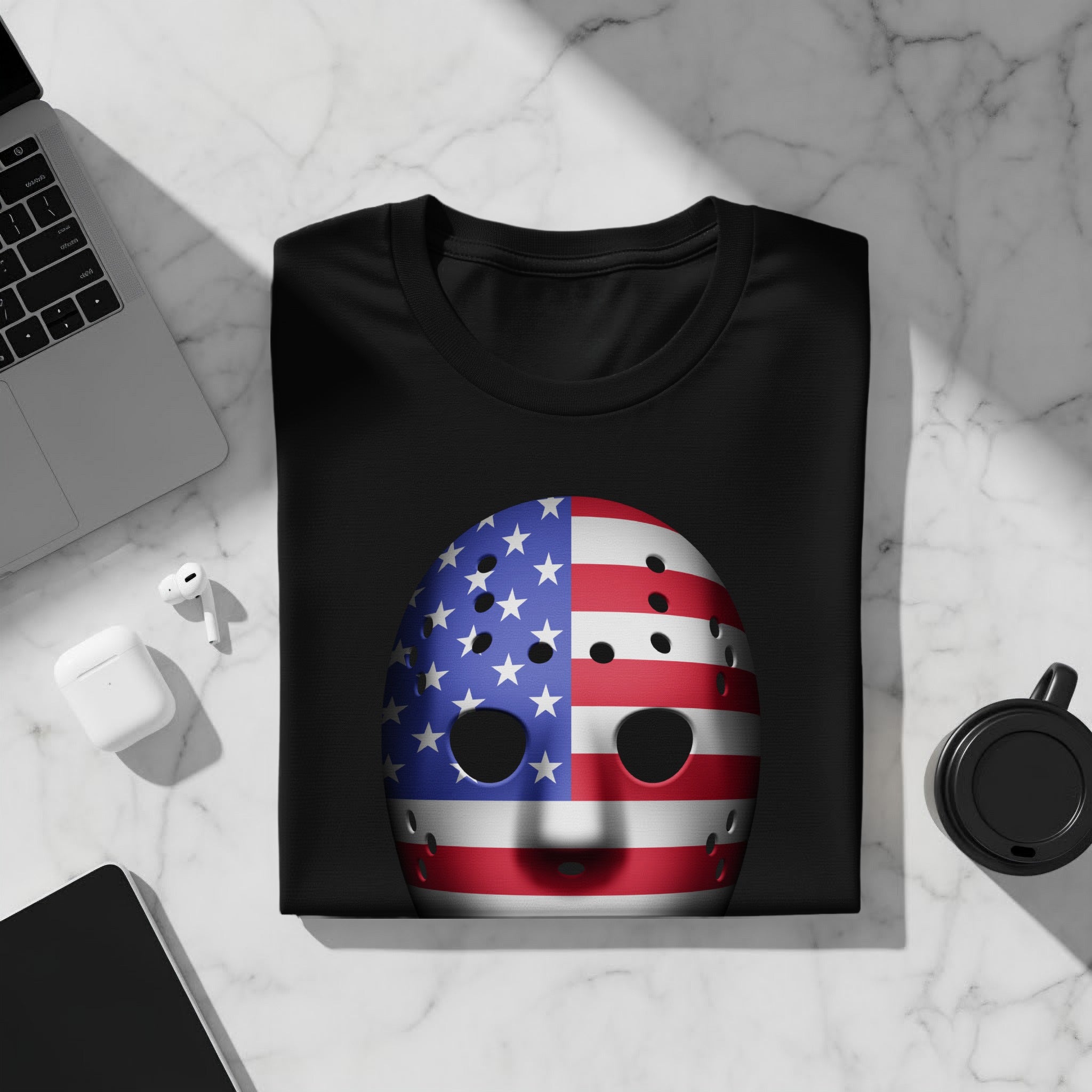 Black t-shirt with American flag hockey mask graphic on front.