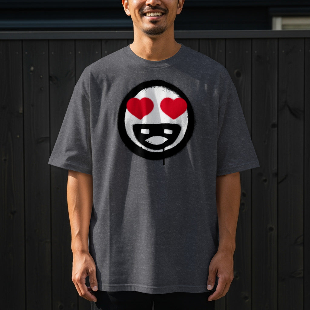 Dark grey t-shirt with a spray-painted black circle graphic featuring a cartoon face with heart eyes.