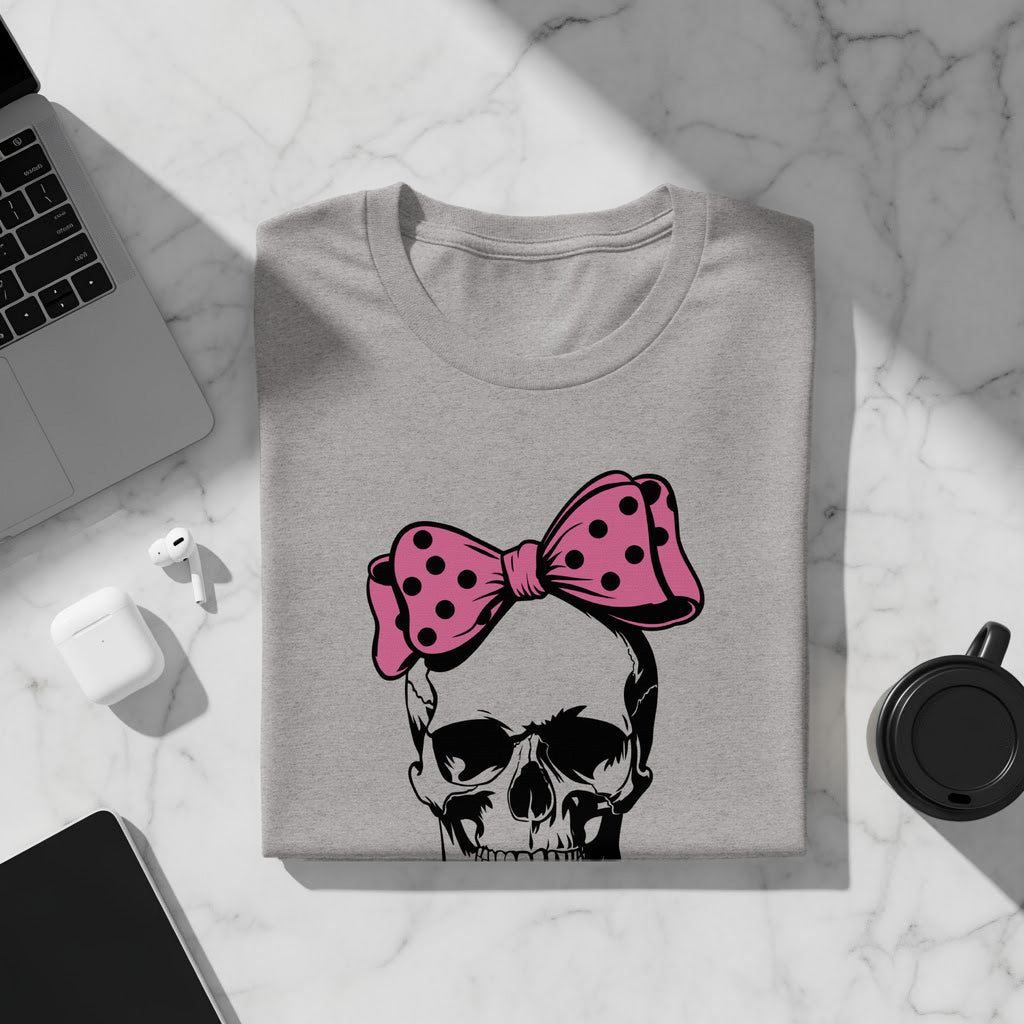Grey t-shirt with a black skull and pink polka dot bow graphic.