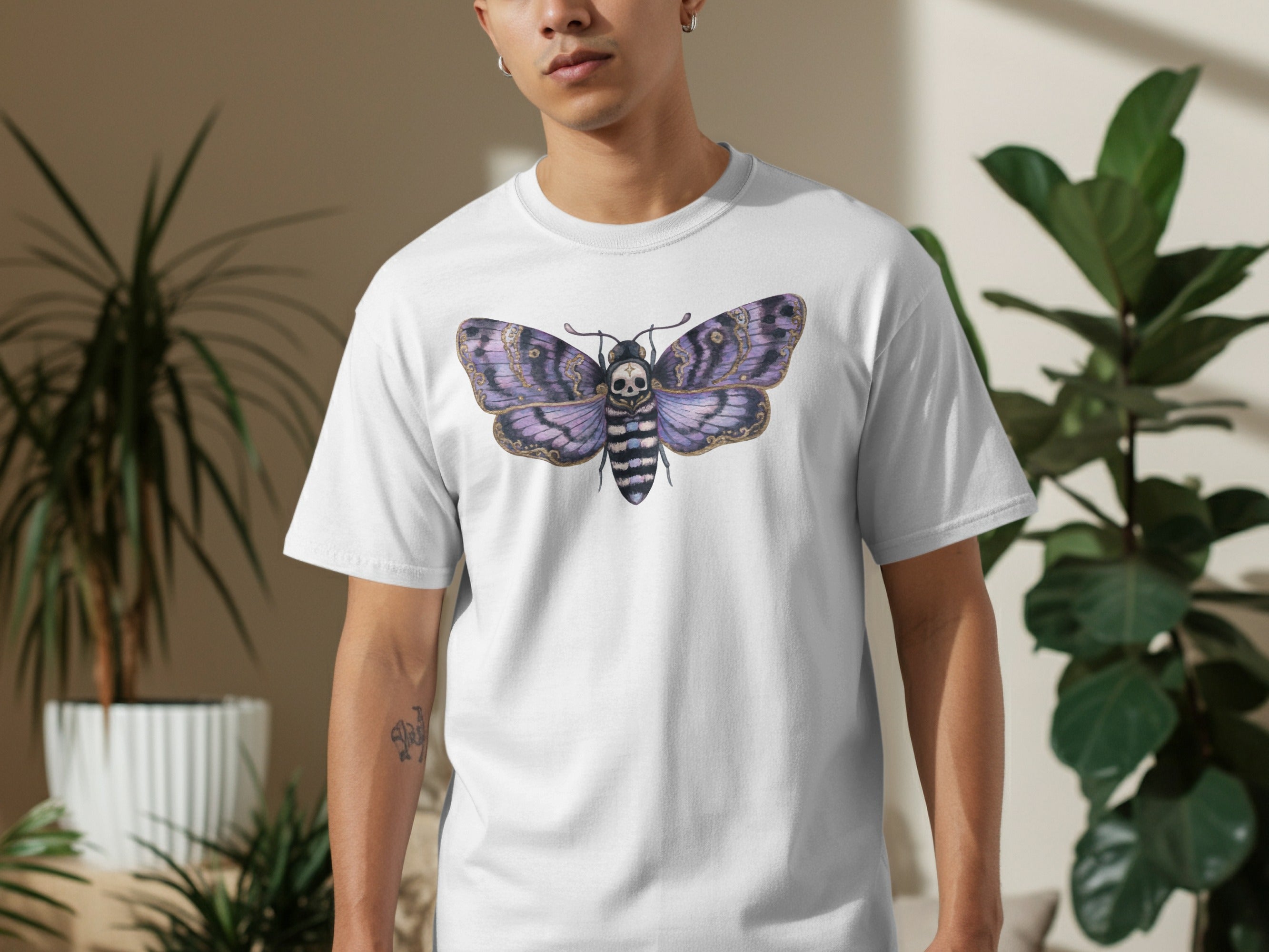 White t-shirt with a purple and black death's-head hawkmoth graphic.