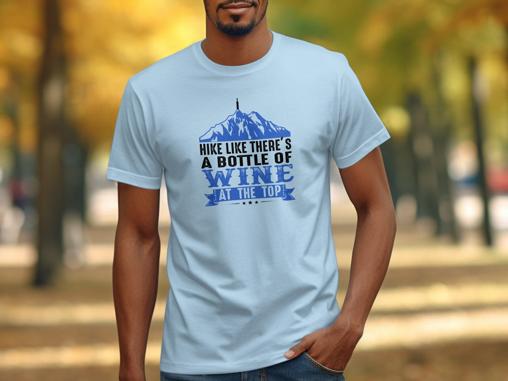 Light blue t-shirt with graphic mountains and text: "Hike Like There's A Bottle of Wine At The Top."