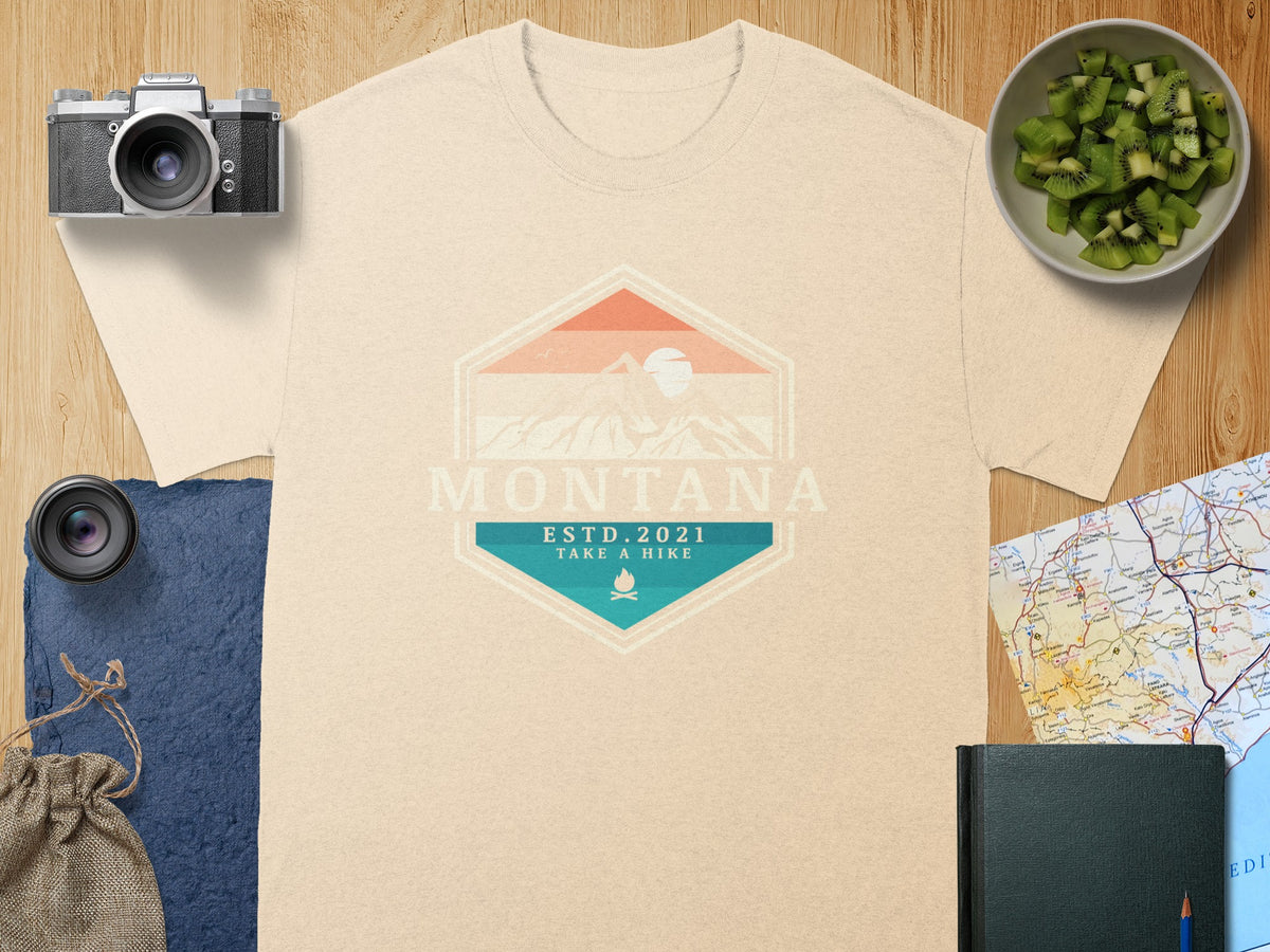 Light beige t-shirt with "MONTANA ESTD. 2021 TAKE A HIKE" graphic.