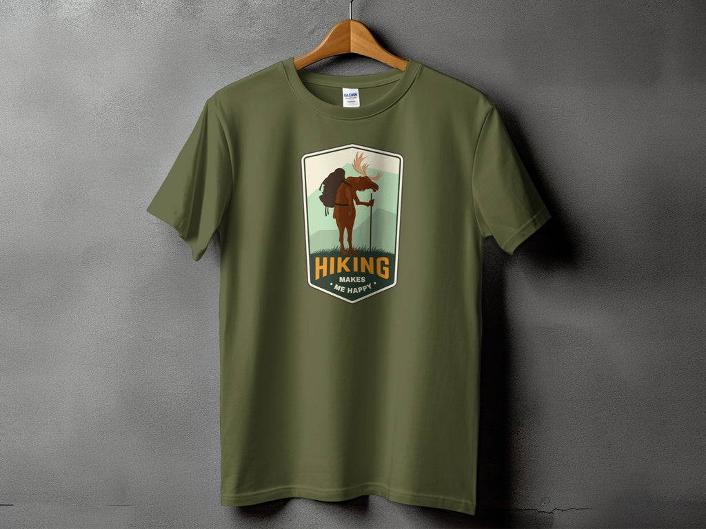 Green t-shirt with a patch showing a moose hiking, text reads "Hiking Makes Me Happy".