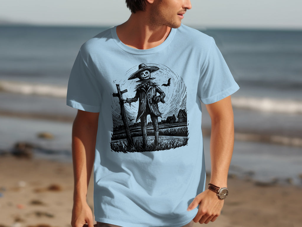 Black and white scarecrow illustration with bat on light blue t-shirt foreground.