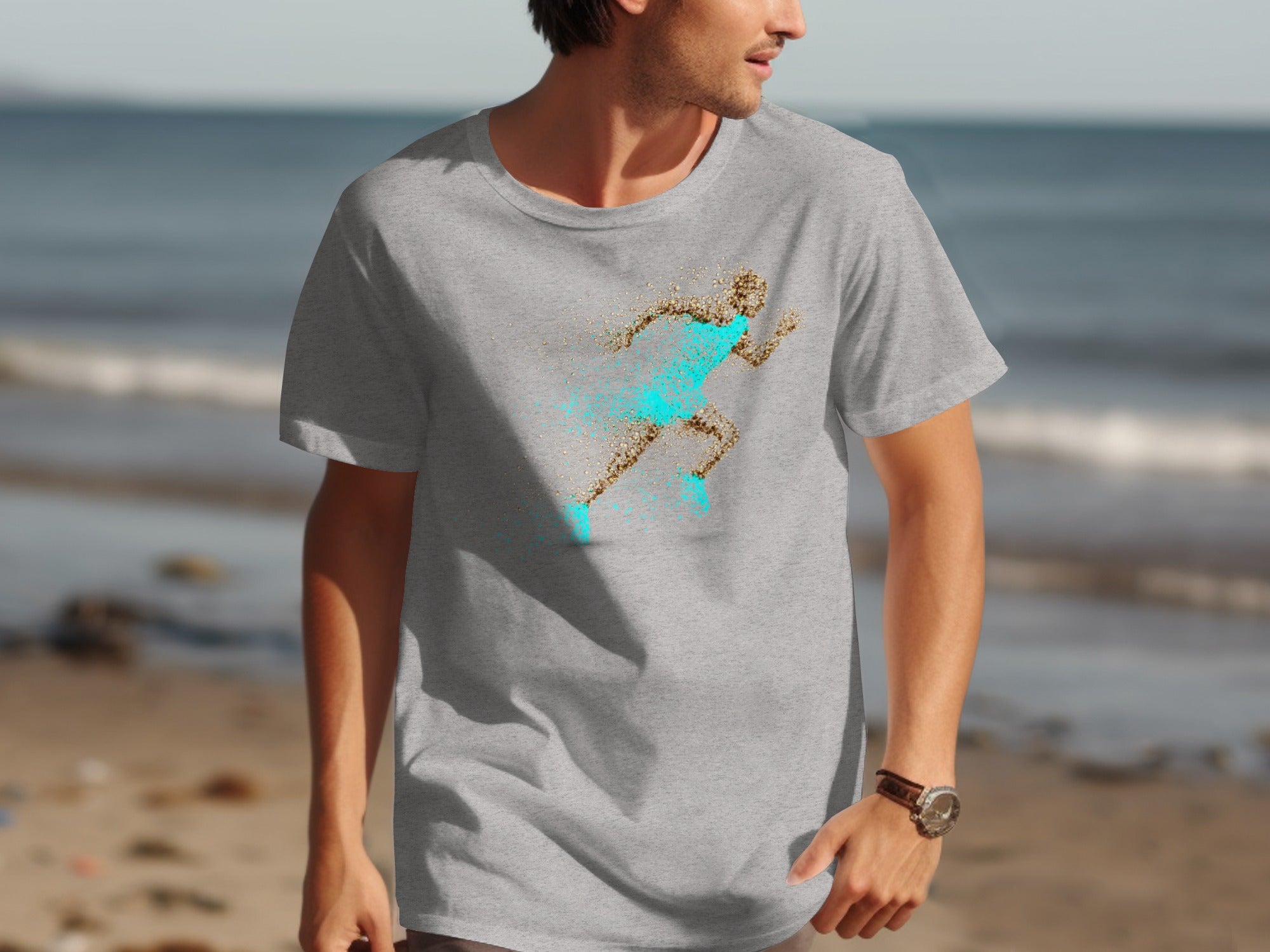 Grey t-shirt with a running figure design made of sand and turquoise.