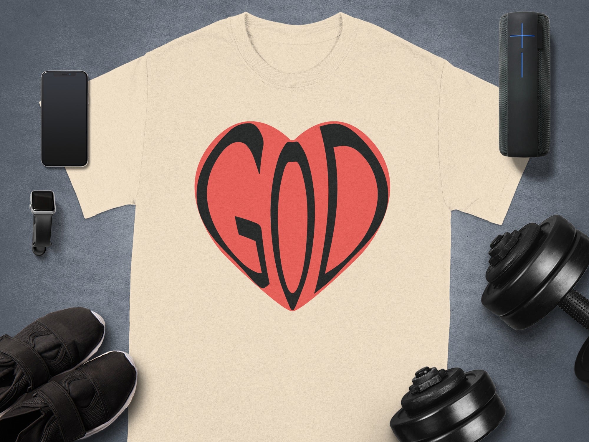 Light tan t-shirt with "GOD" in a red heart graphic.