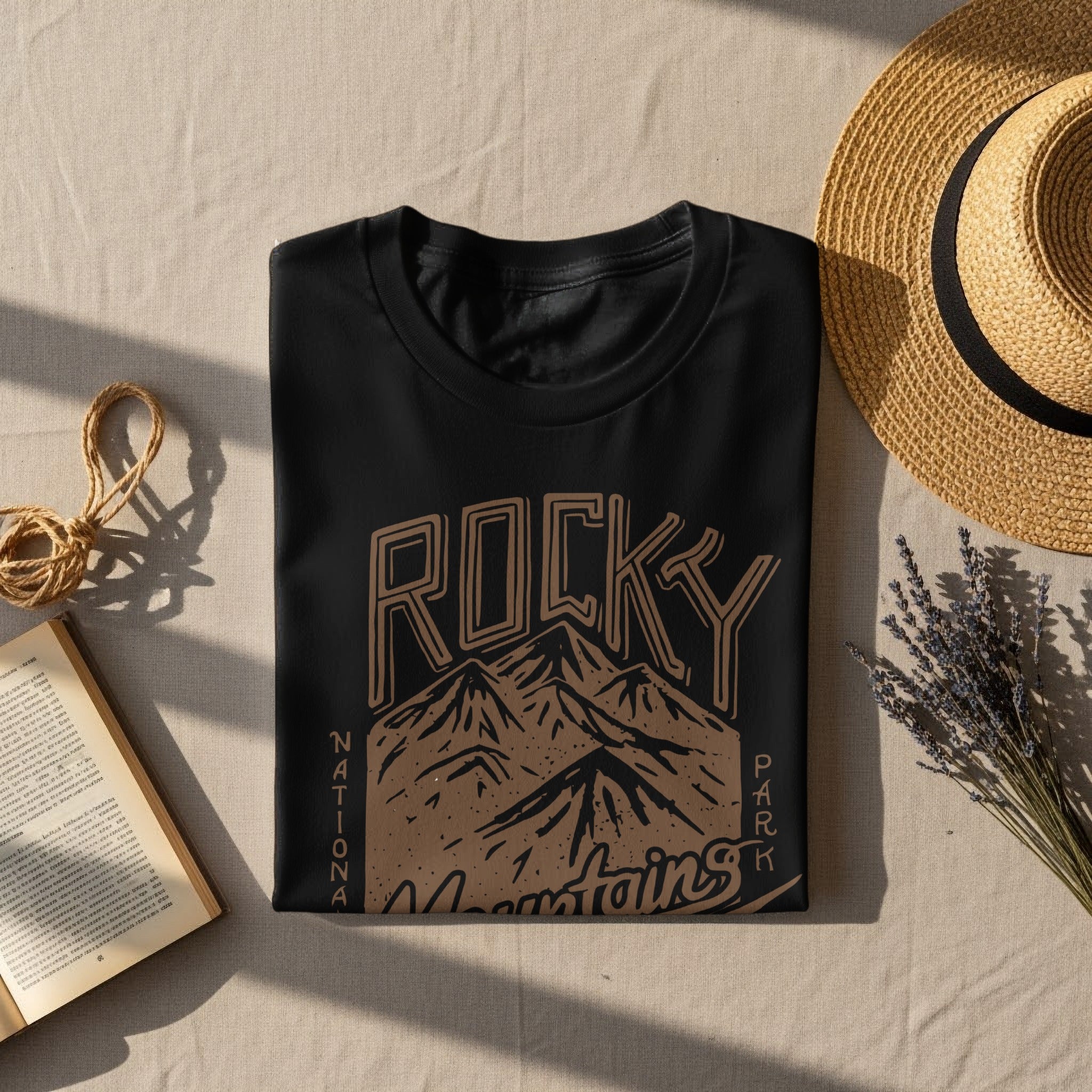 Black t-shirt with Rocky Mountains graphic and text.