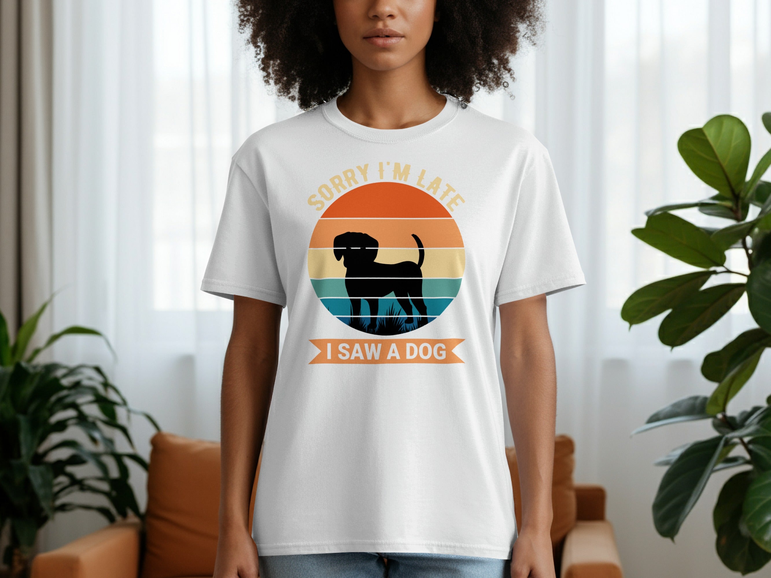 White t-shirt with graphic text "SORRY I'M LATE I SAW A DOG" and dog silhouette.