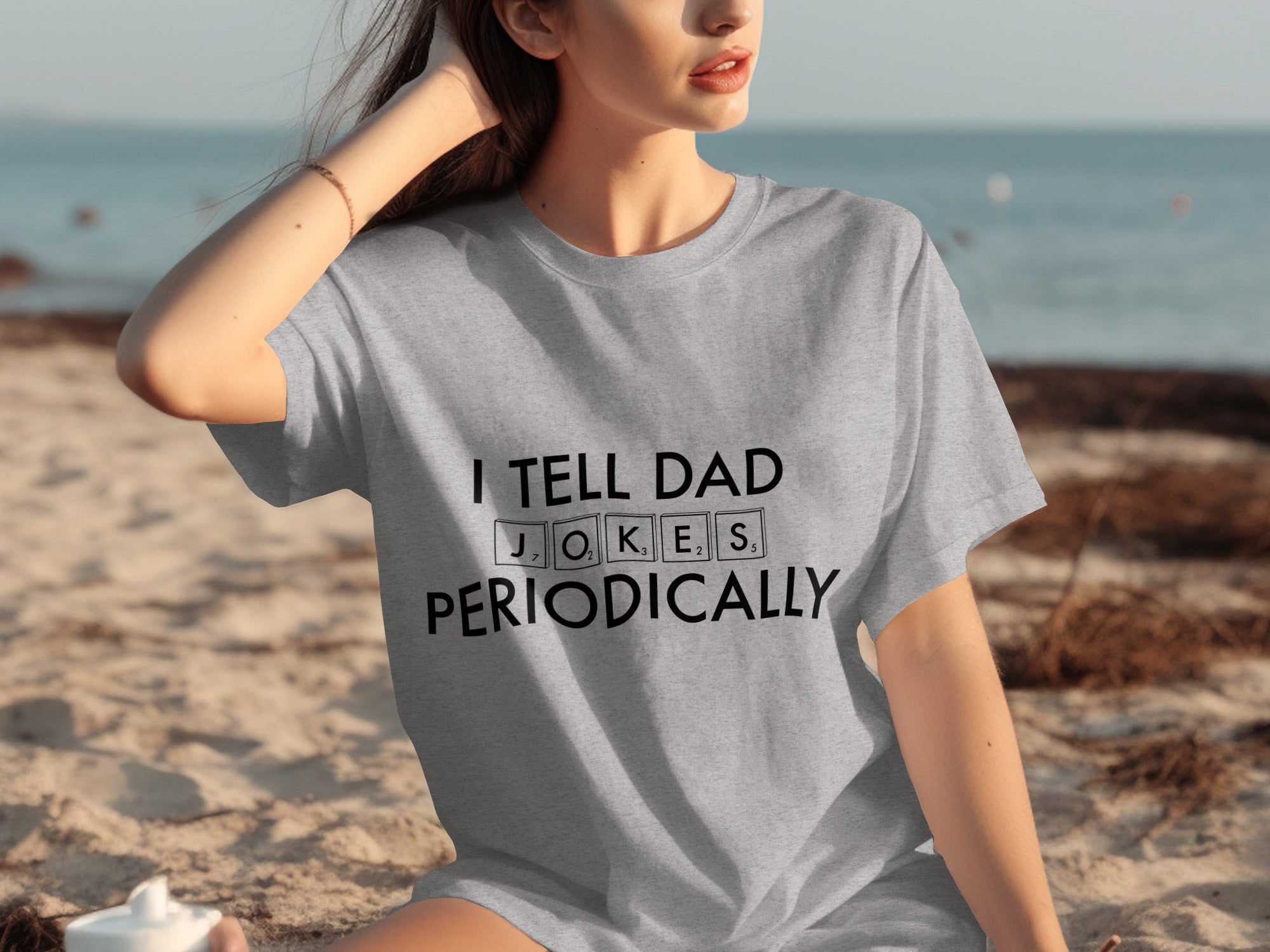Grey t-shirt with "I TELL DAD JOKES PERIODICALLY" text in black.