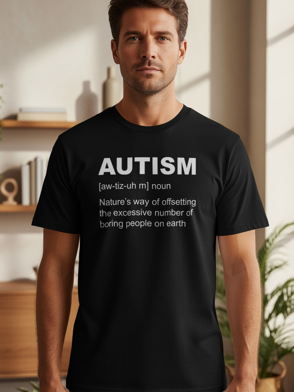Black t-shirt with white text defining autism as "Nature's way of offsetting the excessive number of boring people on earth."