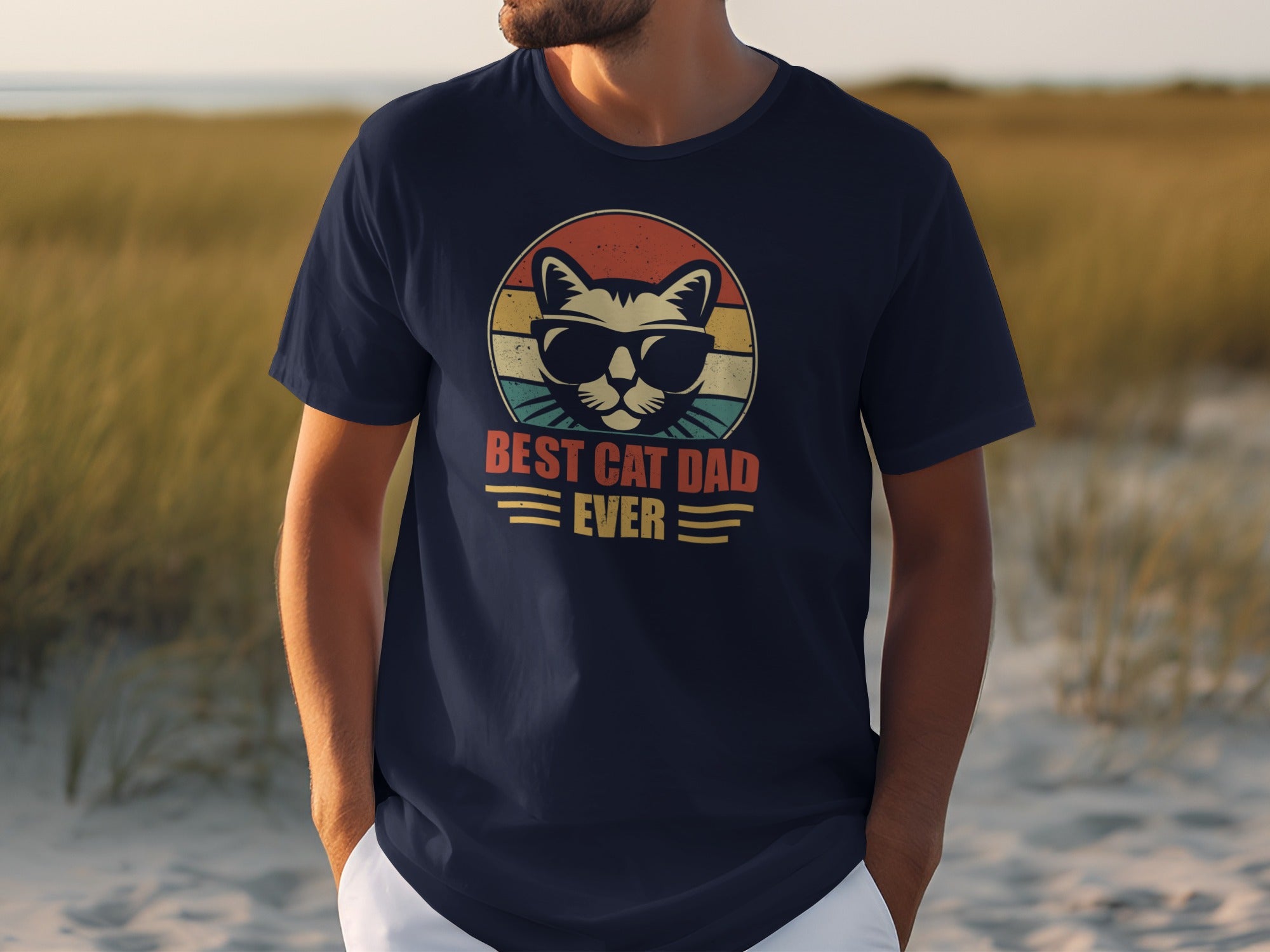 Navy t-shirt with a graphic of a cat wearing sunglasses and "BEST CAT DAD EVER" text.