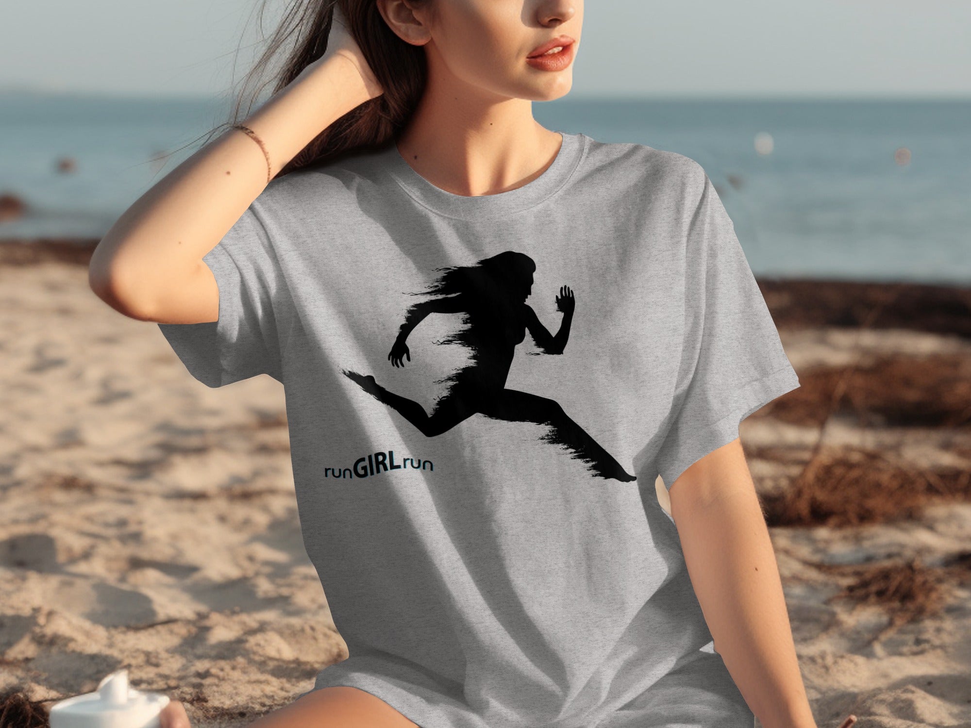 Grey t-shirt with a black silhouette of a runner and text "runGIRLrun".