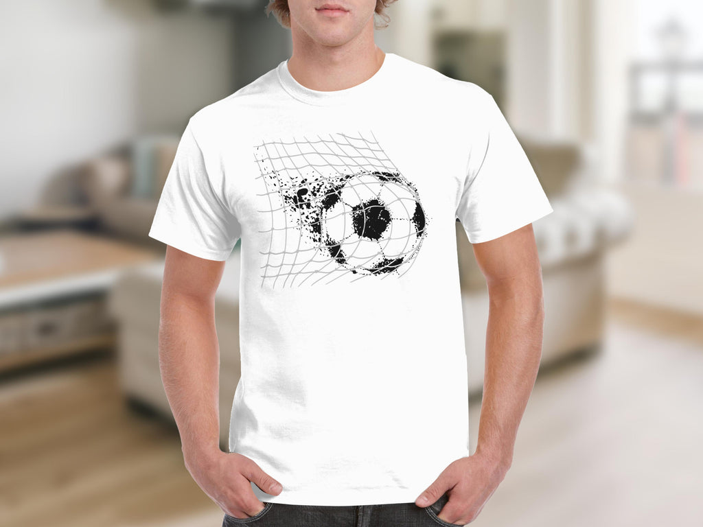 White t-shirt with a black, distressed soccer ball breaking through a net graphic.