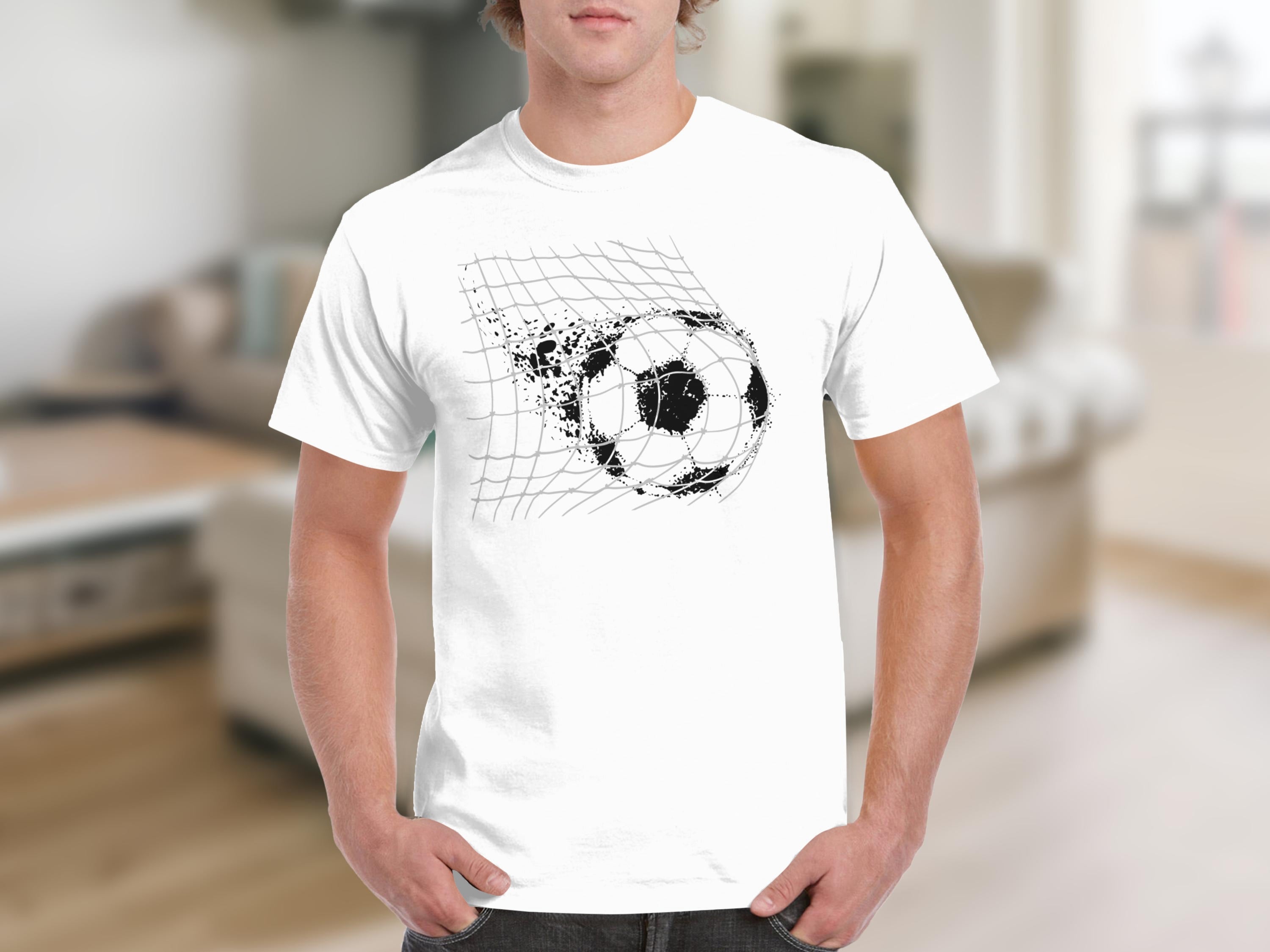 White t-shirt with a black, distressed soccer ball breaking through a net graphic.