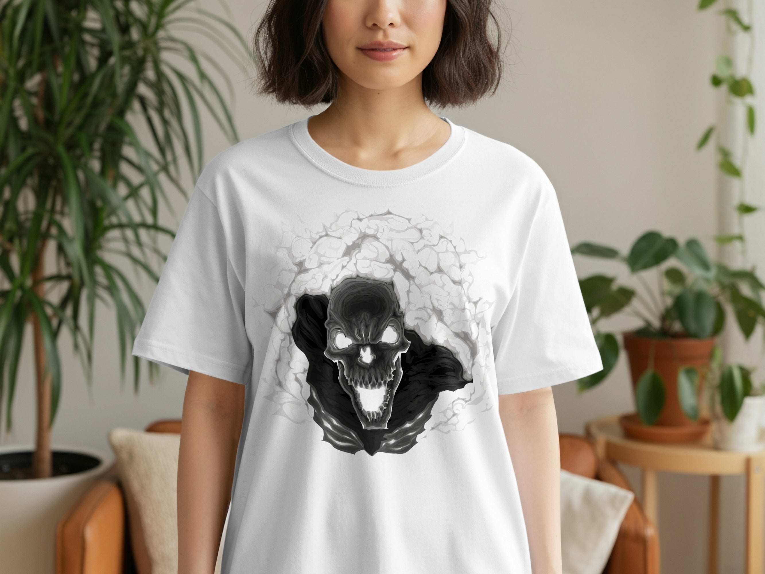 White t-shirt with a black and grey skull emerging from smoke graphic.