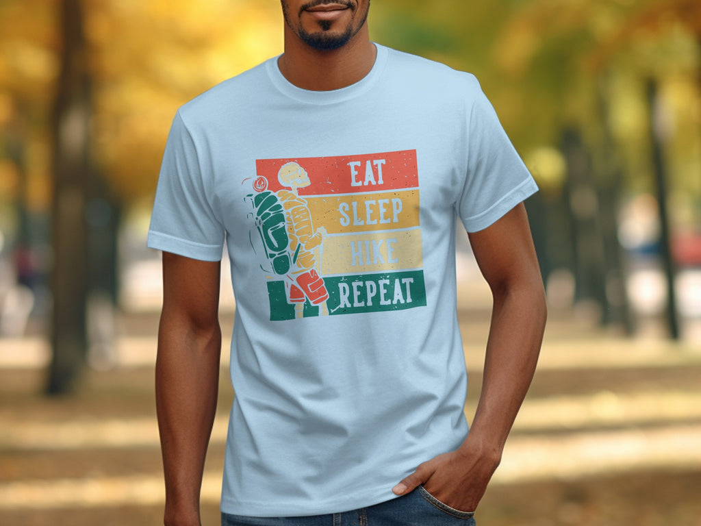 White t-shirt with "Eat Sleep Hike Repeat" text and skeleton hiker graphic.