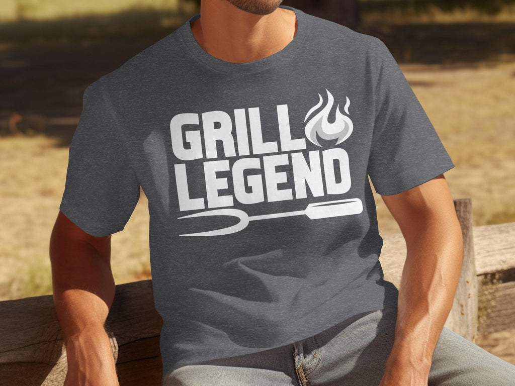 Dark grey t-shirt with "GRILL LEGEND" text, flames, and grilling fork graphic.