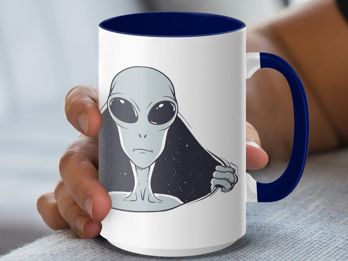 White mug with blue handle featuring a gray alien peeking through torn fabric design.