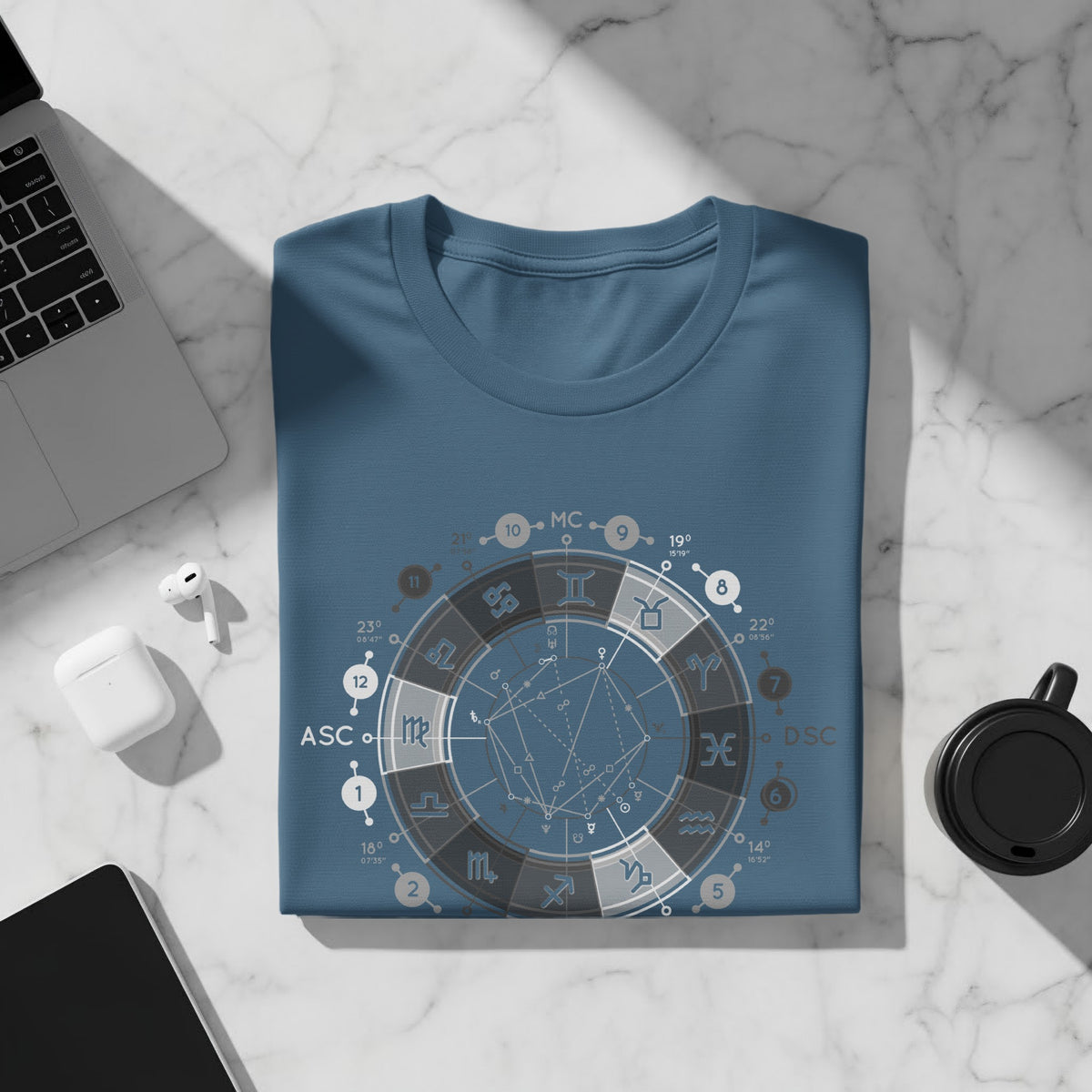Blue t-shirt with a circular astrological chart design featuring zodiac symbols and numbers.