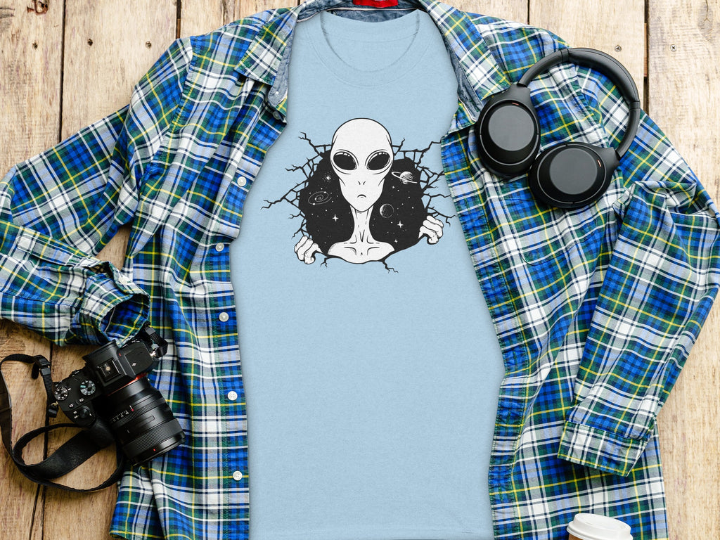 Light blue t-shirt with alien breaking through starry space design